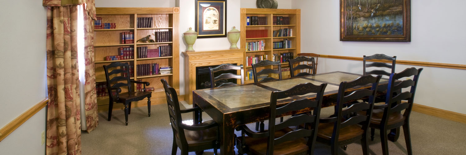 library with large table and bookshelves
